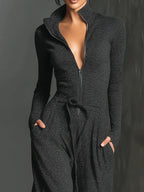 Perla – Mono elegante de punto con brillo y cremallera frontal